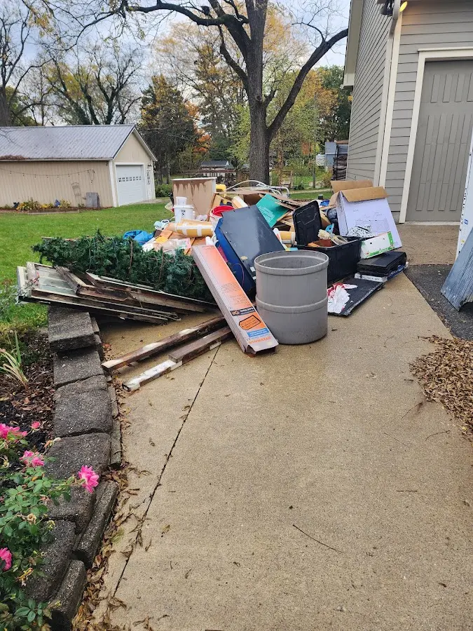 Dumpster being loaded with debris for 3 Yard Dumpster Rental in Conley